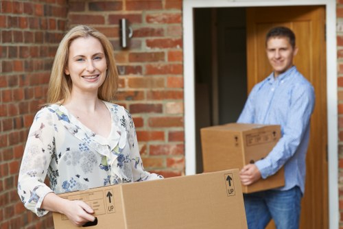 Professional movers packing boxes for a Westharrow relocation