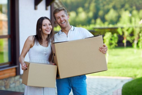 Professional flat removals planning in Westharrow with packed boxes and moving supplies