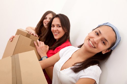 Apartment moving team handling stairs during flat removals in Westharrow