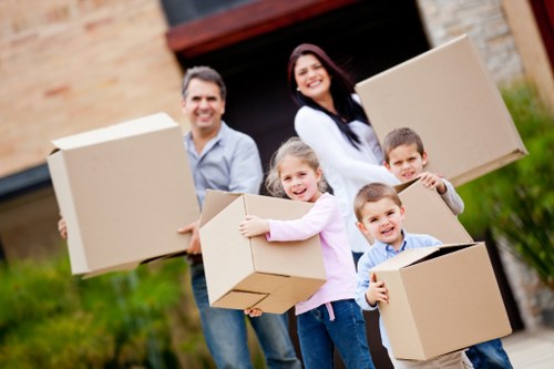 Professional movers loading household items for a Westharrow small move