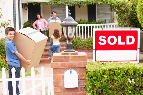 Professional movers handling furniture during a Westharrow relocation